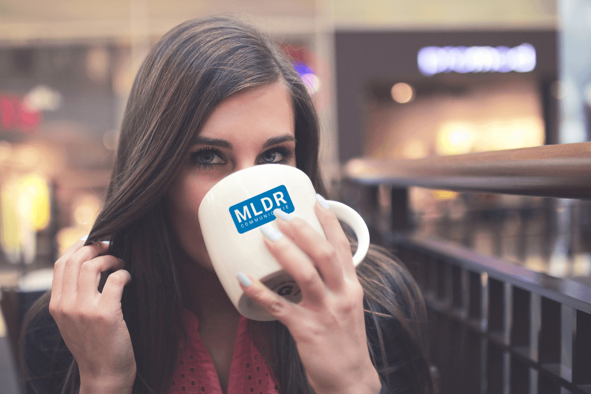 jeshoots woman drinking coffee with mldr logo